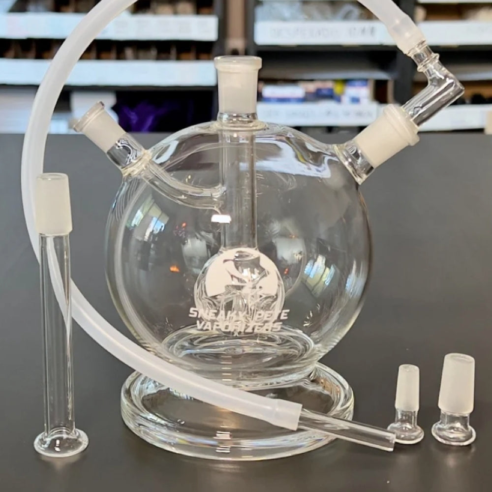 sneaky pete mega globe MK 2 flat earth edition glass rig paired with whip & glass mouthpiece stood upright along side