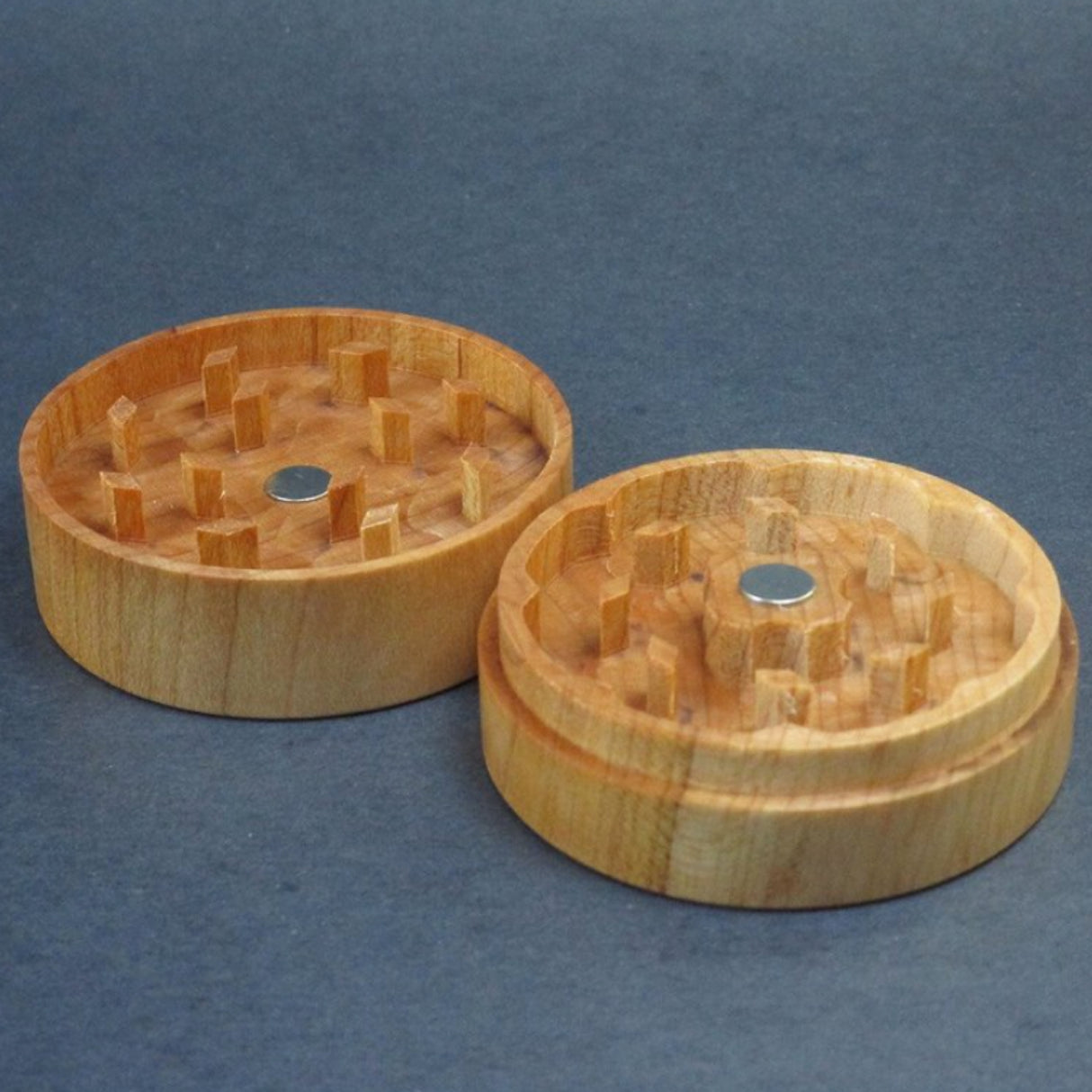 maple futo herb grinder in 2 sections sat on grey background top view