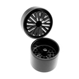 black flowermill mini herb grinder with top section opened on white background