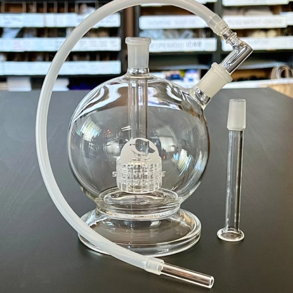 sneaky pete mega globe MK2 flat earth edition glass rig with whip sat on grey surface
