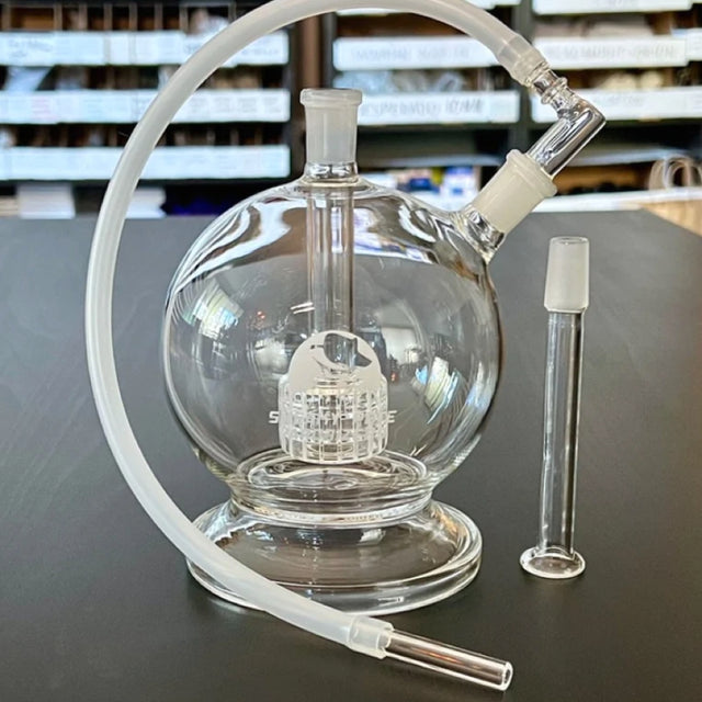 sneaky pete mega globe MK2 flat earth edition glass rig with whip sat on grey surface