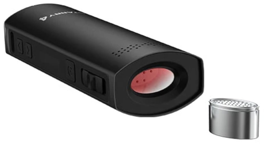black xmax starry 4 vaporizer lying flat with mouthpiece removed and dosing capsule sat close by  on white background