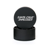 large matt black santa cruz shredder herb grinder with the lid section sitting on top of the base. Santa Cruz logo on lid.