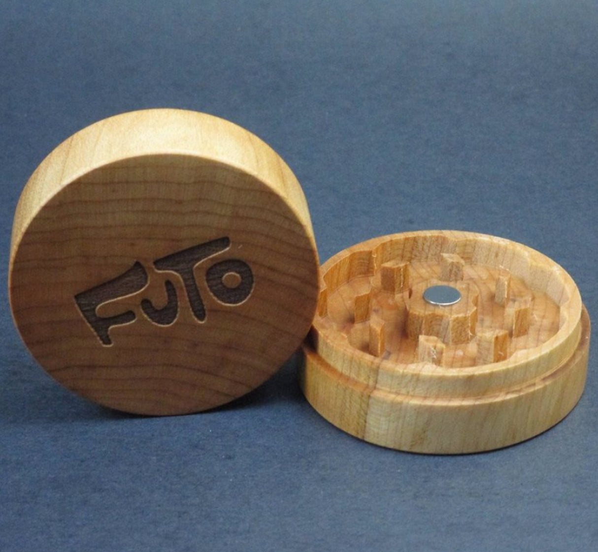 maple futo herb grinder in 2 sections sat on grey background