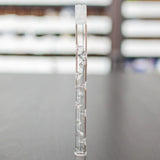 sneaky pete 130mm 3D glass add-a-cap accessory stood upright on grey surface