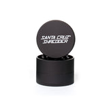 medium matt black 4 piece santa cruz shredder herb grinder with the lid section sitting on top of the base. Santa Cruz logo on lid.